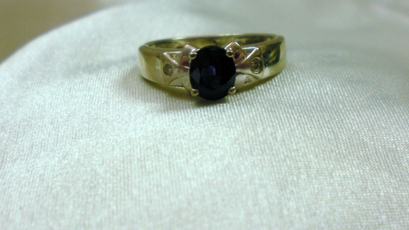 14k White Gold and Sapphire Ring with Embedded Diamonds  